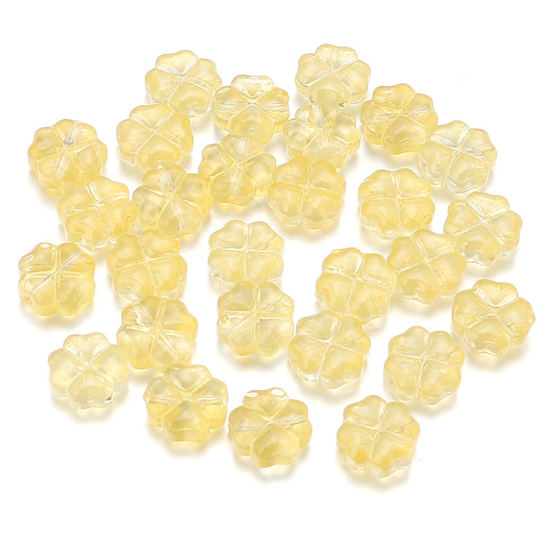 Al por mayor de 50 piezas/paquete de vidrio de color transparente de color trébol de cuatro hojas